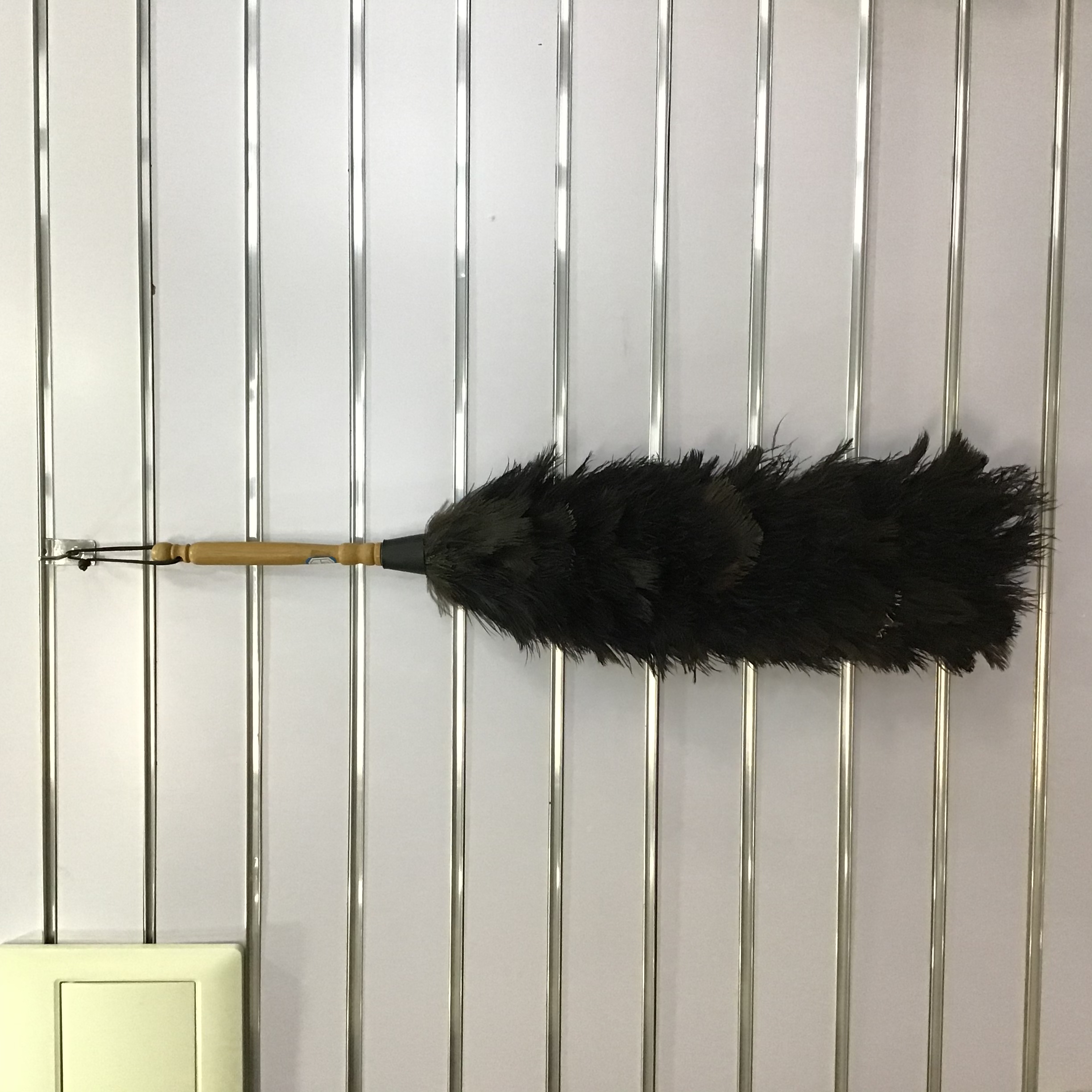 black ostrich feather duster with long head and bamboo handle