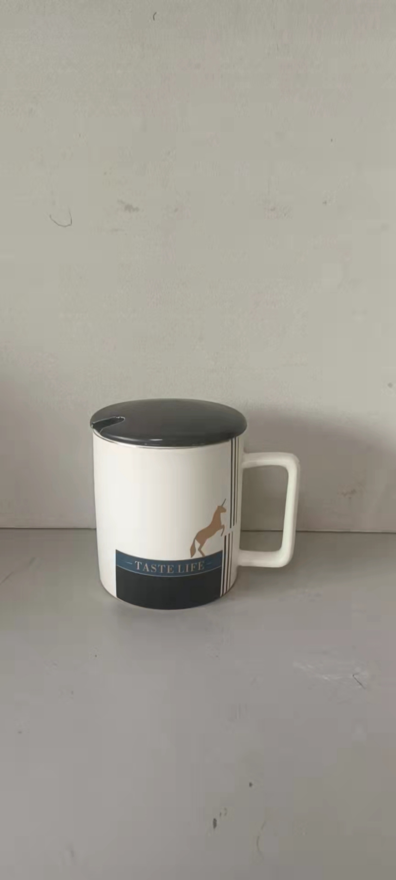 Beautiful ceramic cup with spoon and cover