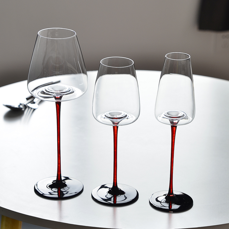 Red wine glasses with red sticks