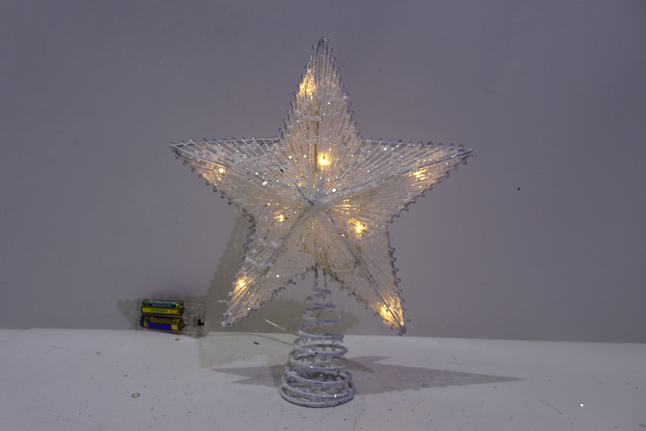Cotton line star tree topper with battery lights