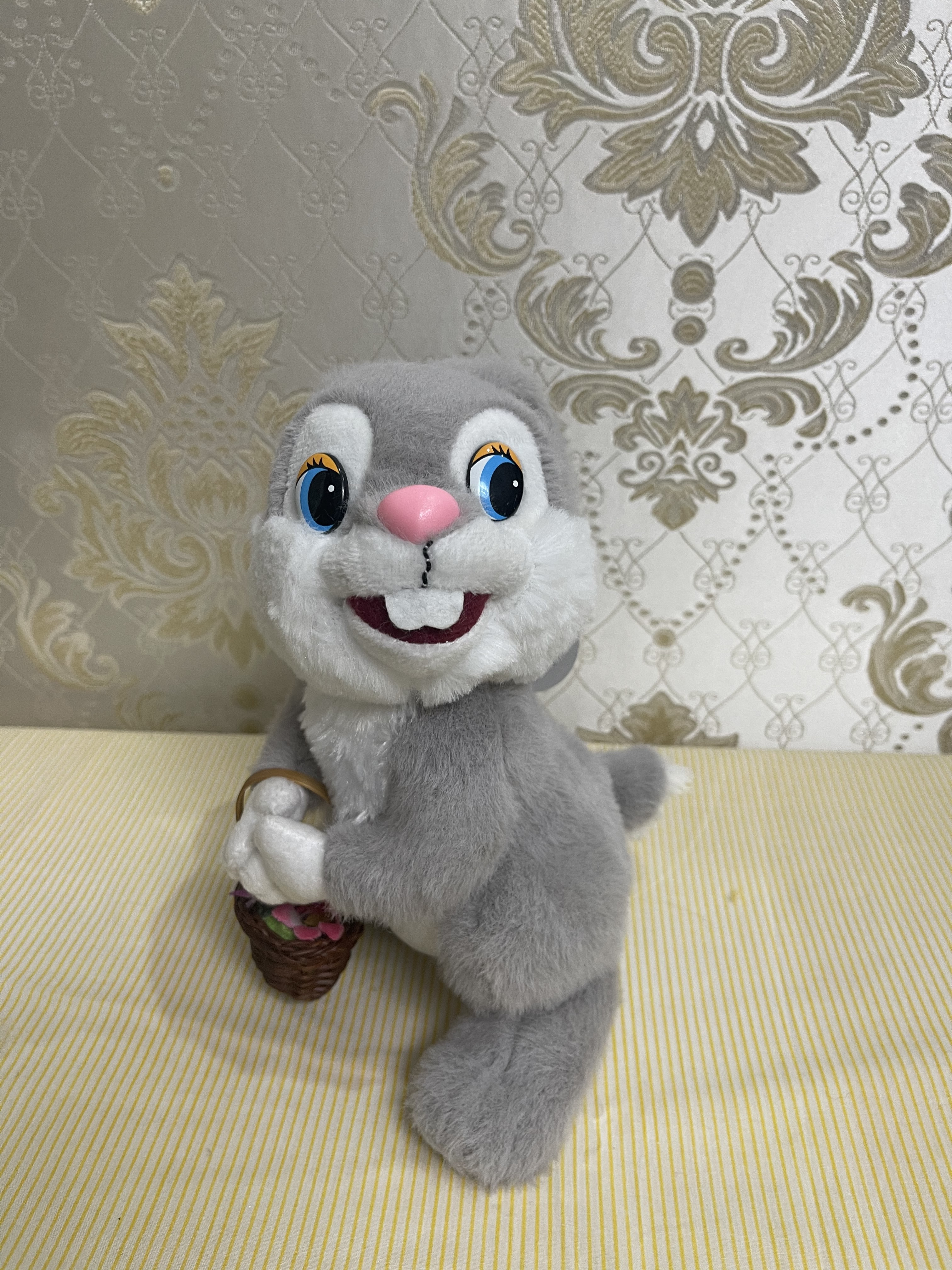 Grey rabbit carrying basket