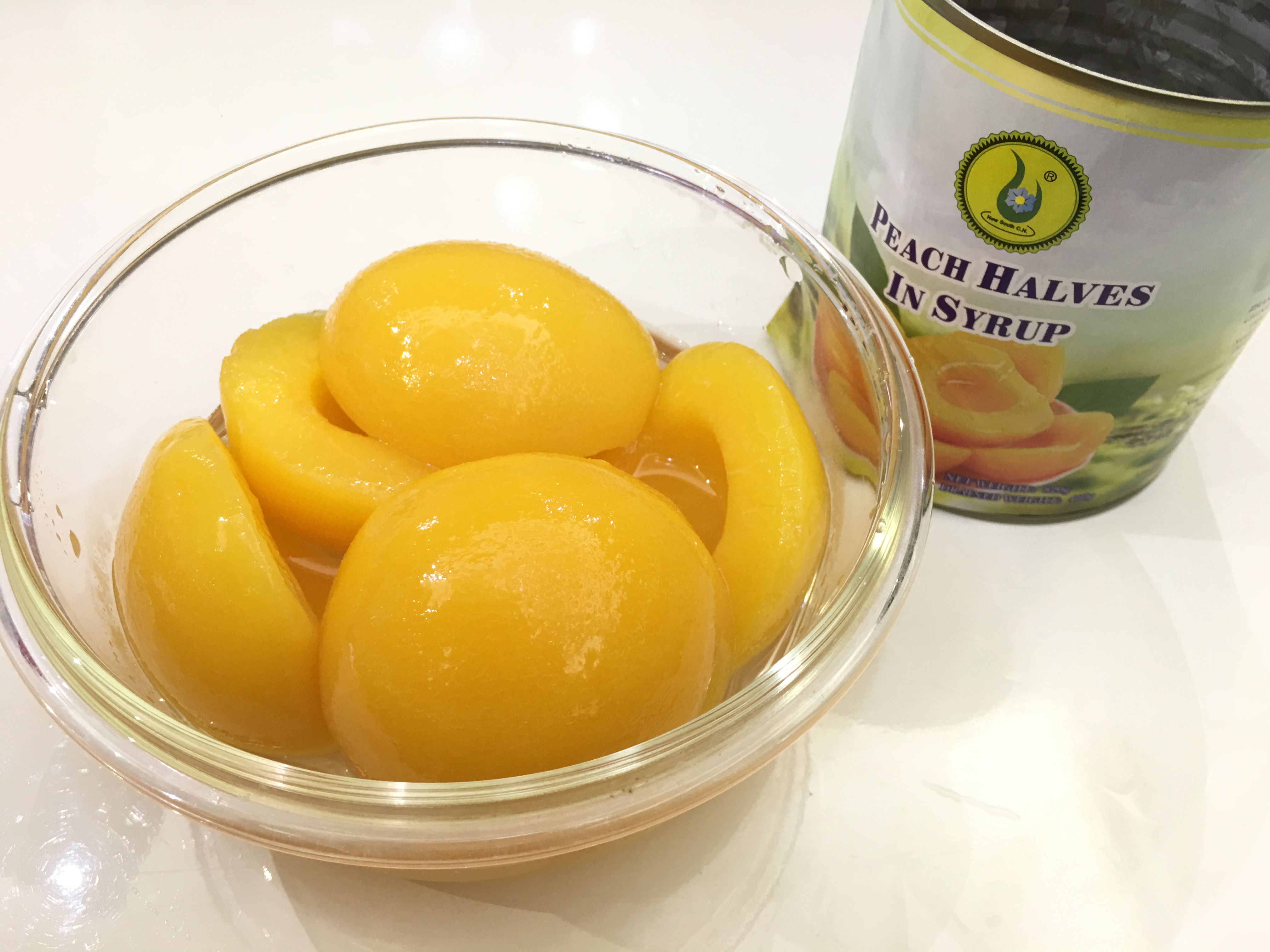 Canned yellow peach in syrup