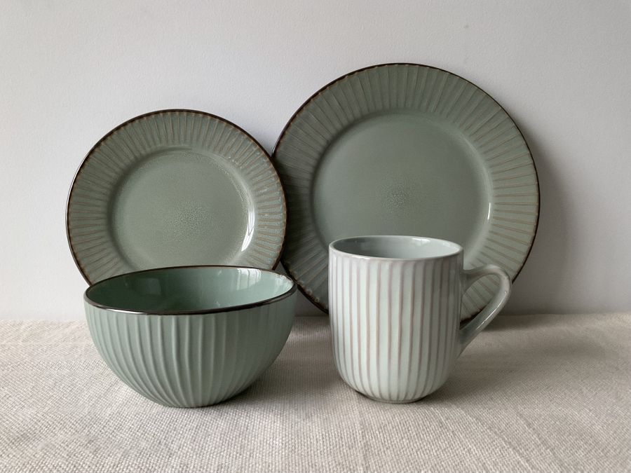 Embossed reactive glaze